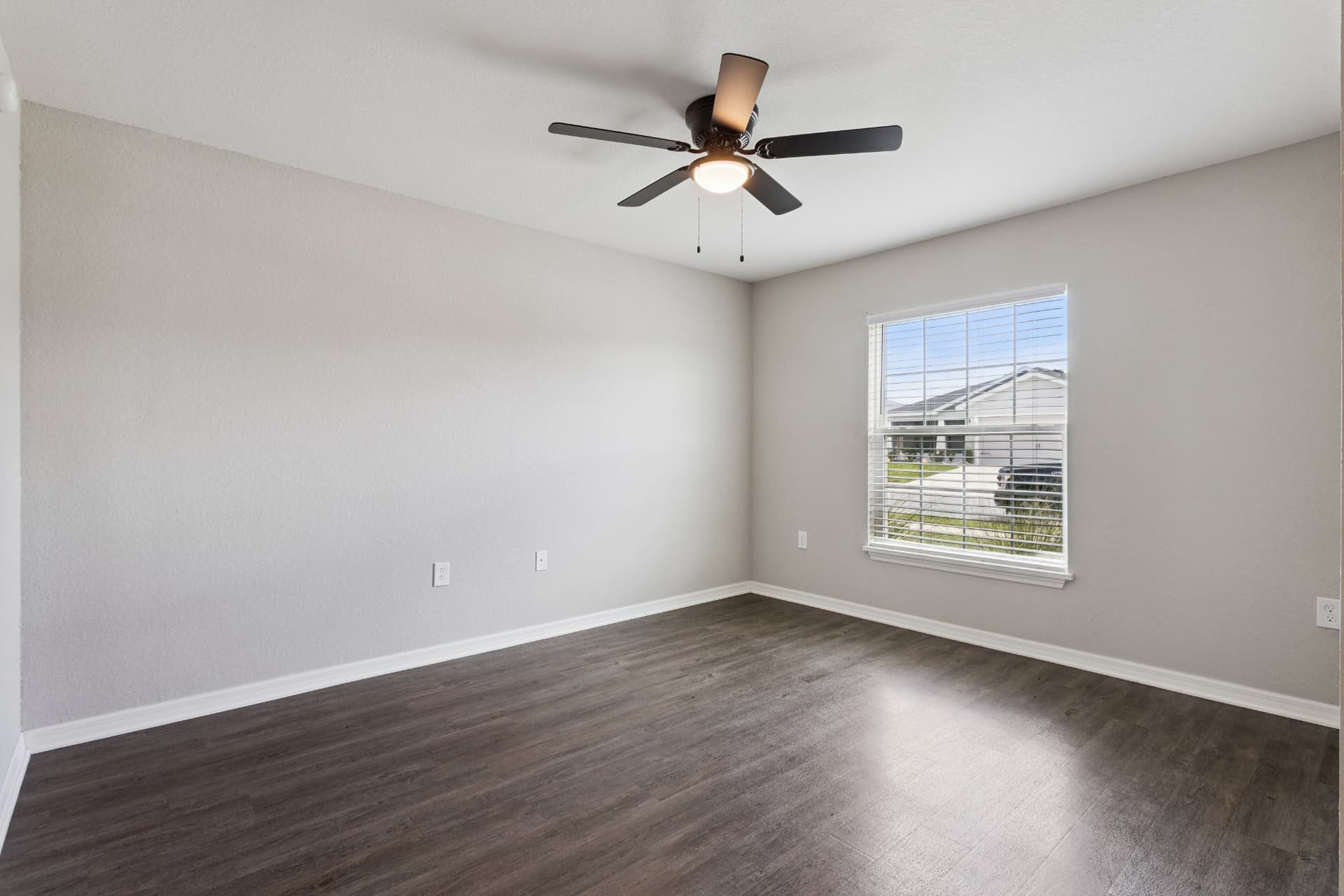 Bedroom with ceiling fan and window